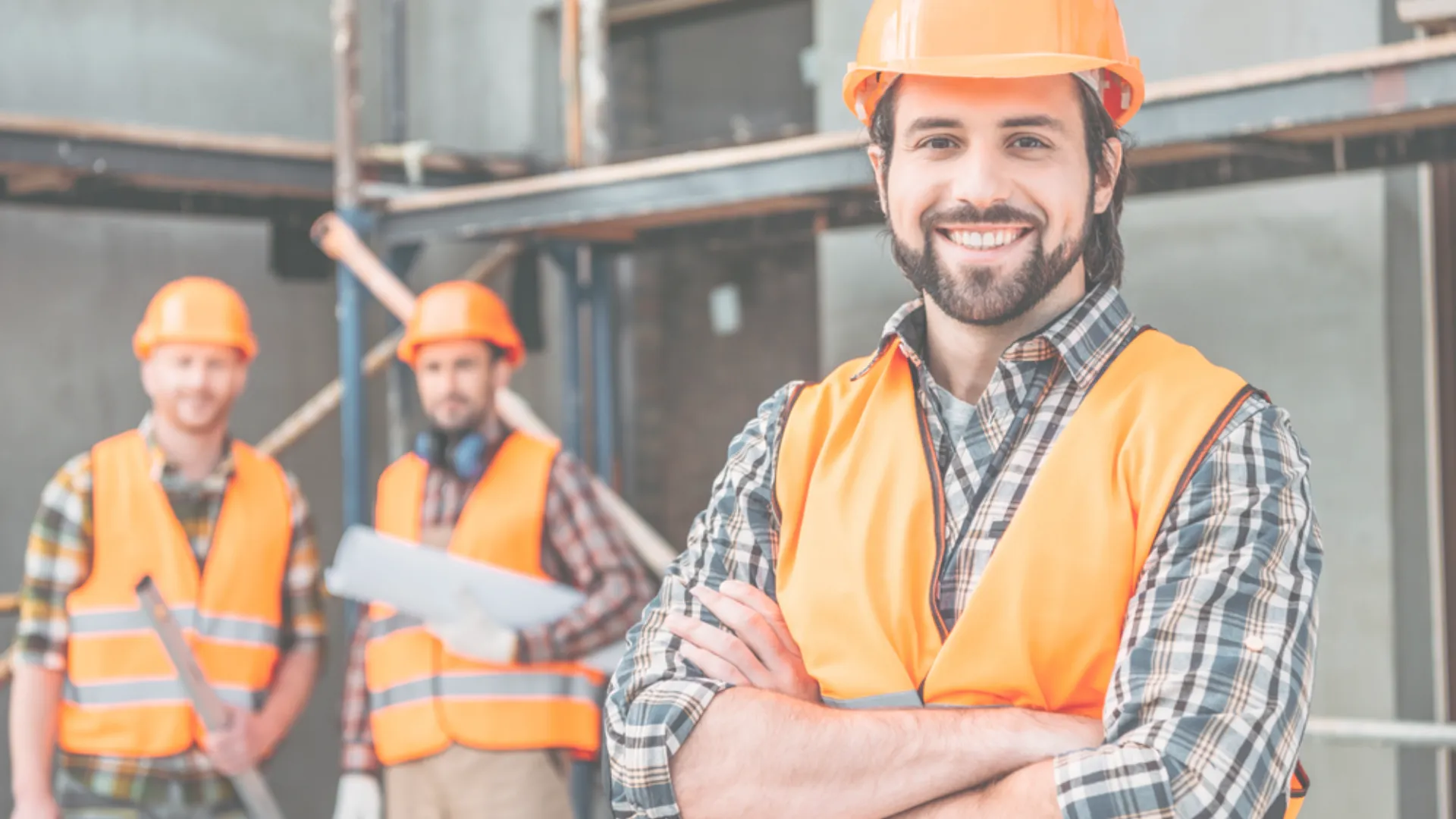 Three construction workers on a job site in Southern California