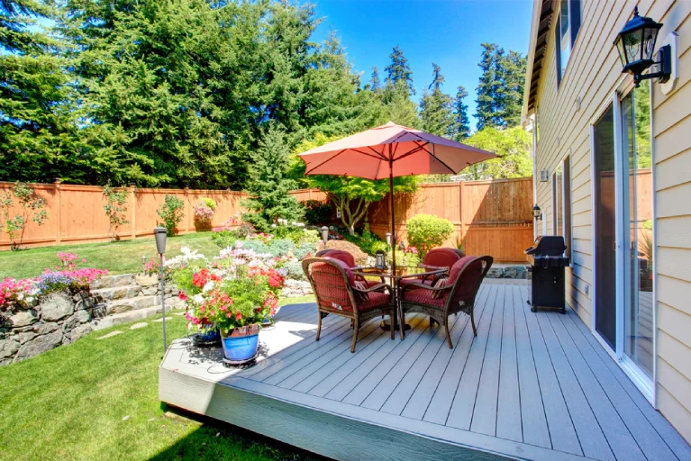 Charming backyard deck with umbrella and seating area—built by affordable deck builders near me in Southern California for budget-conscious homeowners.