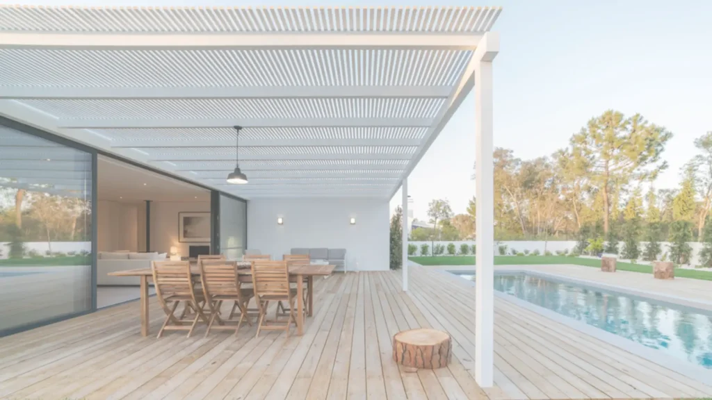 Modern wood deck with pergola and pool in a Southern California backyard designed by expert deck builders.