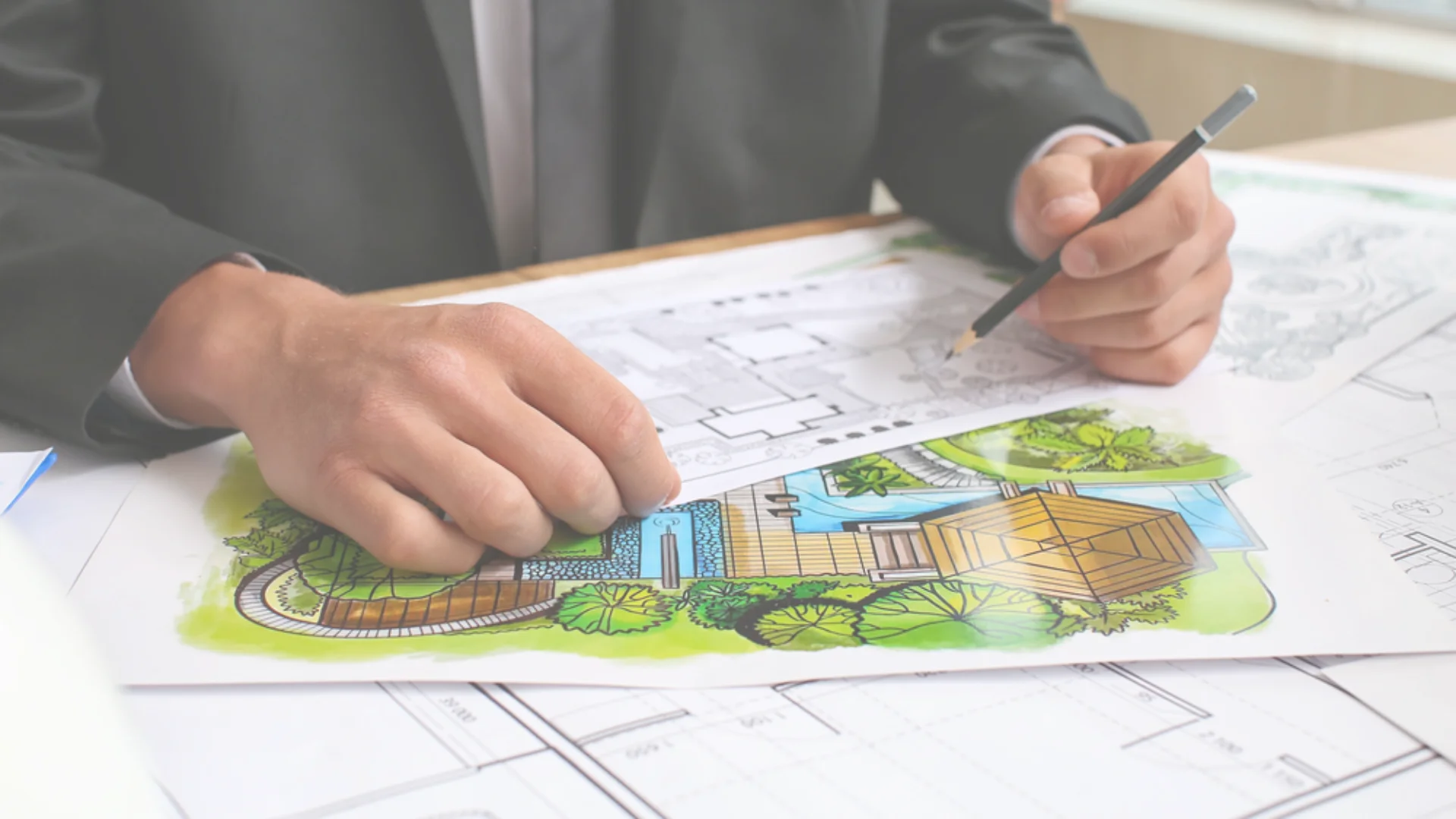 A designer sketching a new landscape design for a home in Southern California