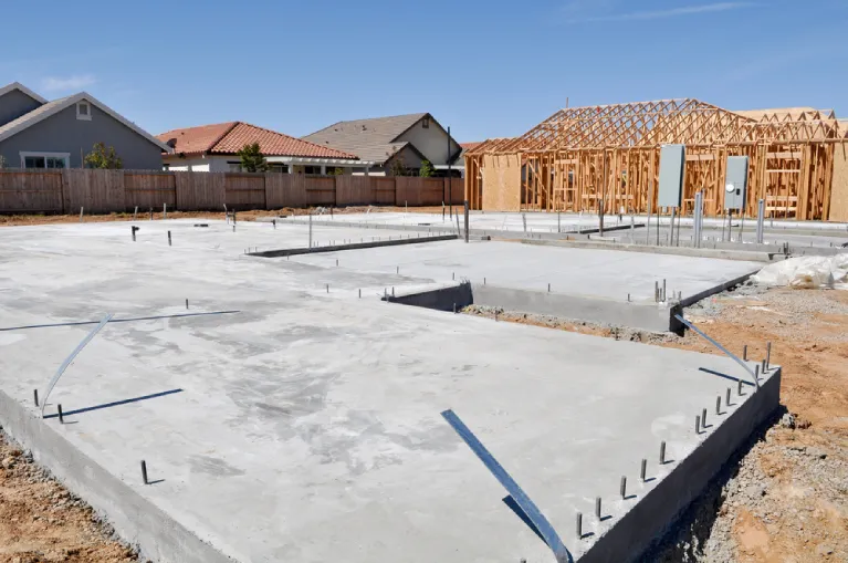 Newly poured concrete foundation for a residential home under construction in Southern California