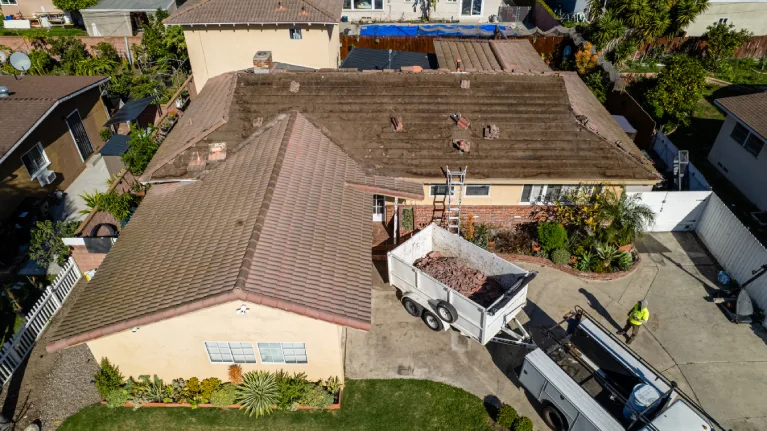 deteriorated residential roof with worn shingles prior to replacement in Garden Grove CA exterior renovation
