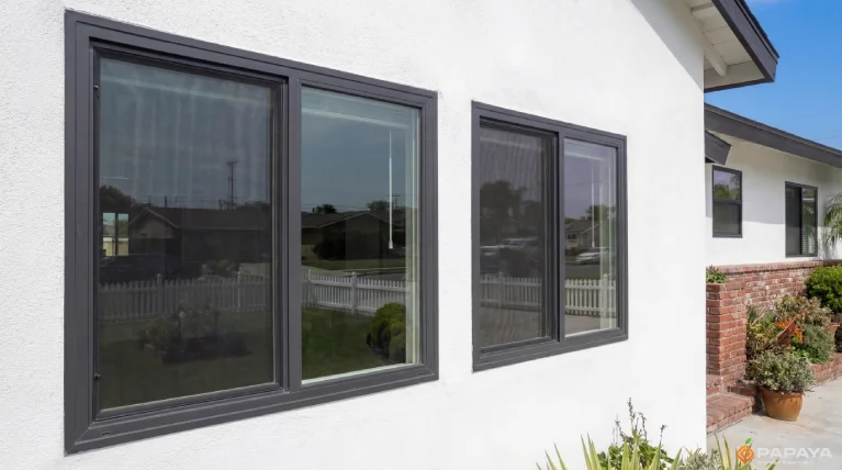 new dual pane vinyl windows with black frames installed on modernized home exterior in Garden Grove California