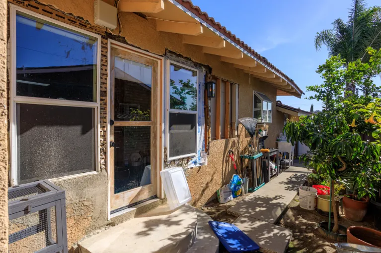 removal of outdated windows and exterior doors during renovation of Garden Grove California home before upgrade