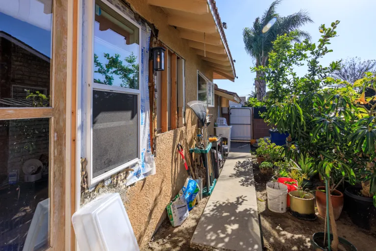 removal of outdated windows and exterior doors during renovation of Garden Grove California home before upgrade